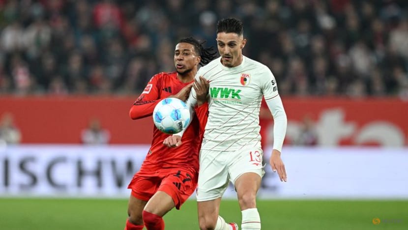 Bayern battle past 10-man Augsburg but Musiala goes off injured