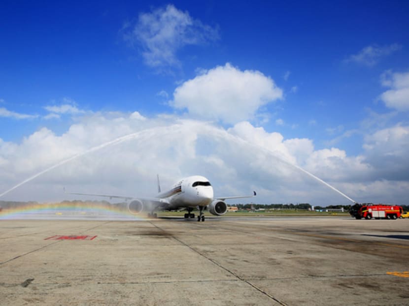 Singapore Airlines’ new A350 receiving a water cannon salute when it arrived at Changi Airport yesterday. Photo: Koh Mui Fong