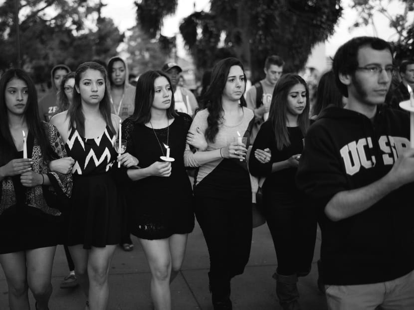 Students at a candlelight vigil to honour victims killed by Elliot Rodger, who was bitter towards women who rejected him. Photo: AP