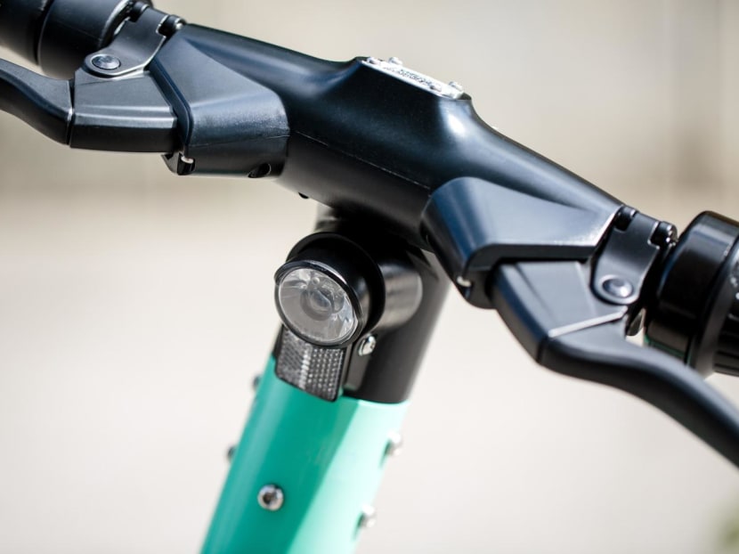 A close-up view of an electric scooter's handle. Zaharah Sa'at knew that riding an e-scooter on the road in Singapore was prohibited when she was caught doing so.
