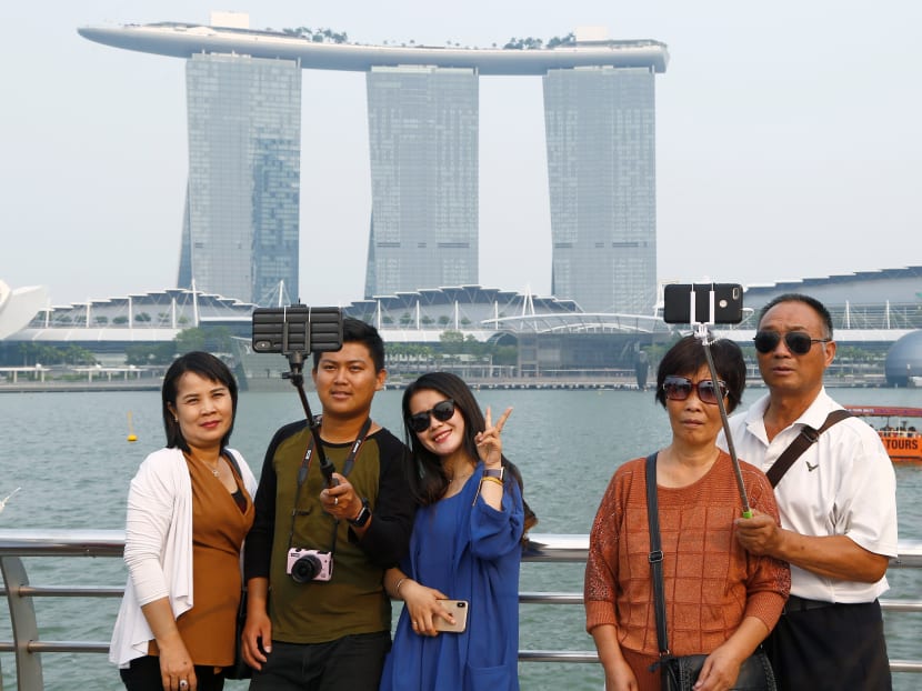 Tourists taking photos at Marina Bay in September 2019.