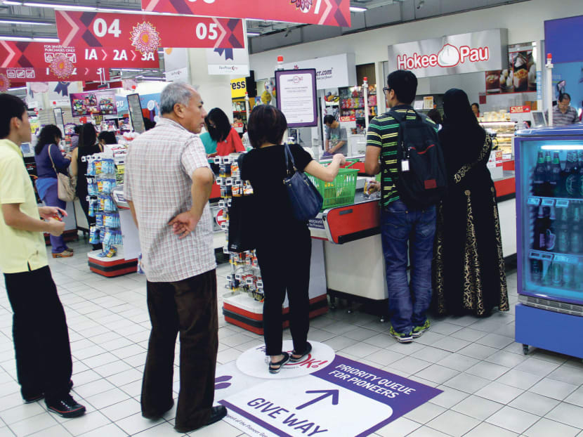 There will be priority queues created for the pioneer generation at NTUC supermarkets, pharmacies, food courts and NTUC Income branches. Photo: Geneieve Teo