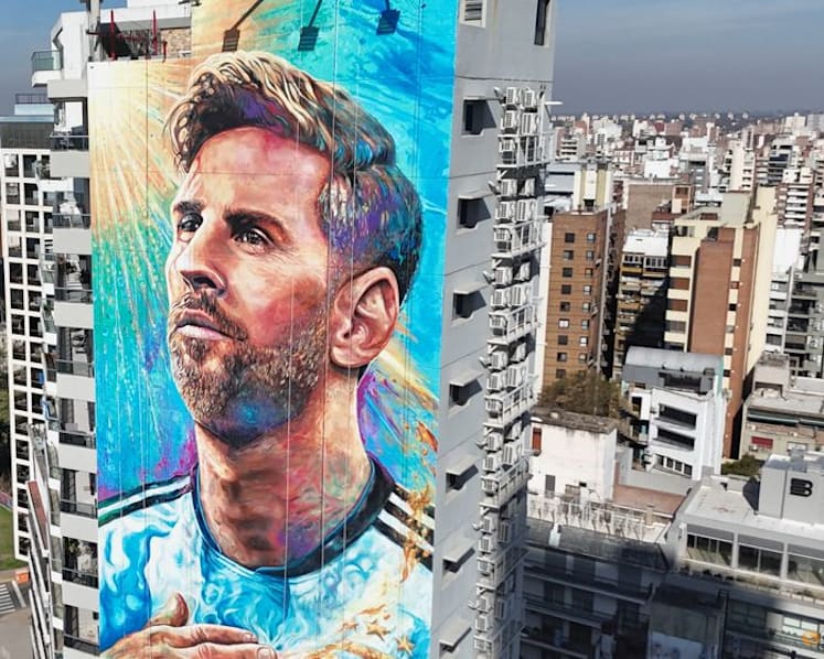 Artists restore gigantic Messi mural in his hometown
