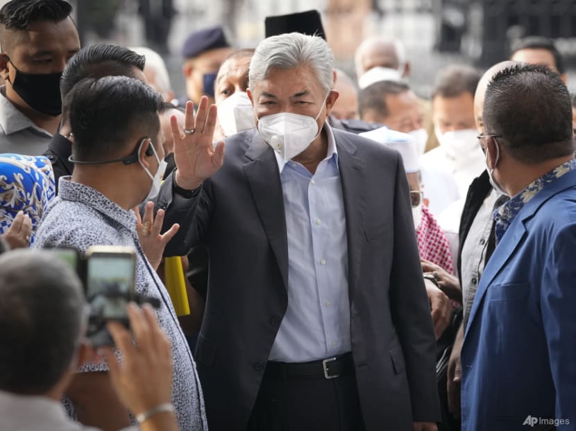 UMNO president Ahmad Zahid ordered to enter defence on corruption, money laundering charges