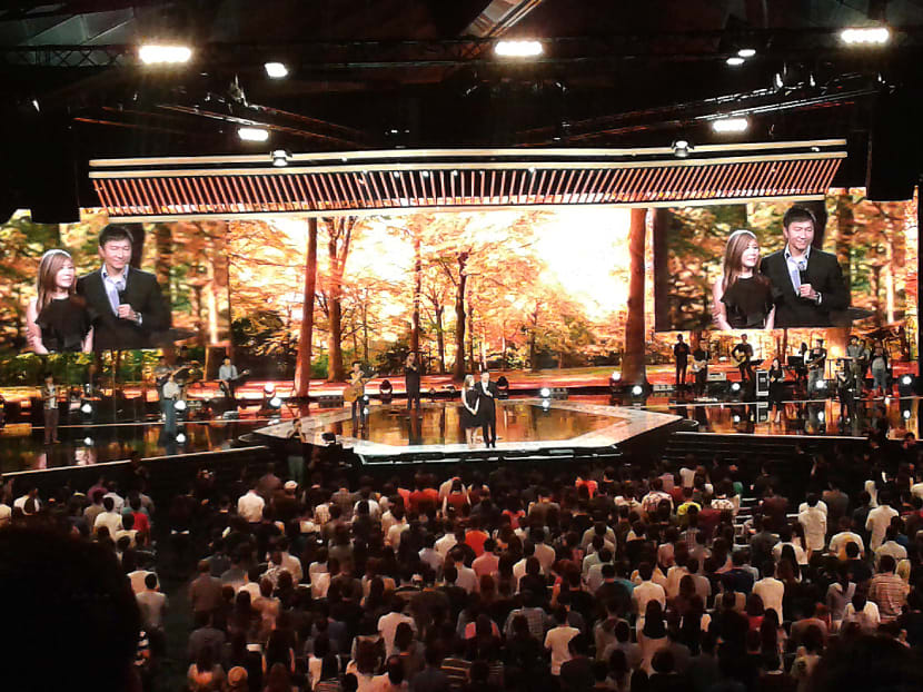 Kong Hee and his wife during the church service at Suntec Singapore Convention and Exhibition Centre on Oct 26, 2015. Photo: Wee Teck Hian/TODAY