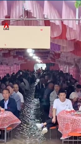 China wedding banquet carries on despite ankle-deep floodwaters