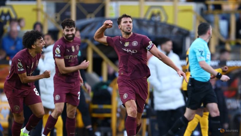 Stones late show earns Man City win at Wolves
