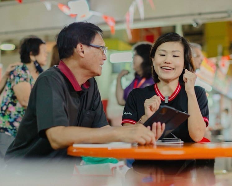 Why this bank lawyer volunteers to teach seniors how to use digital banking apps and PayLah! 