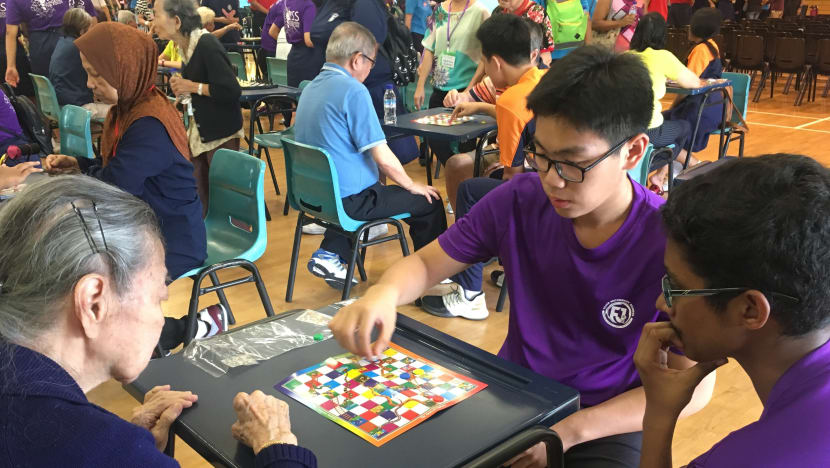 Fajar Sec students work together to organise games with the elderly