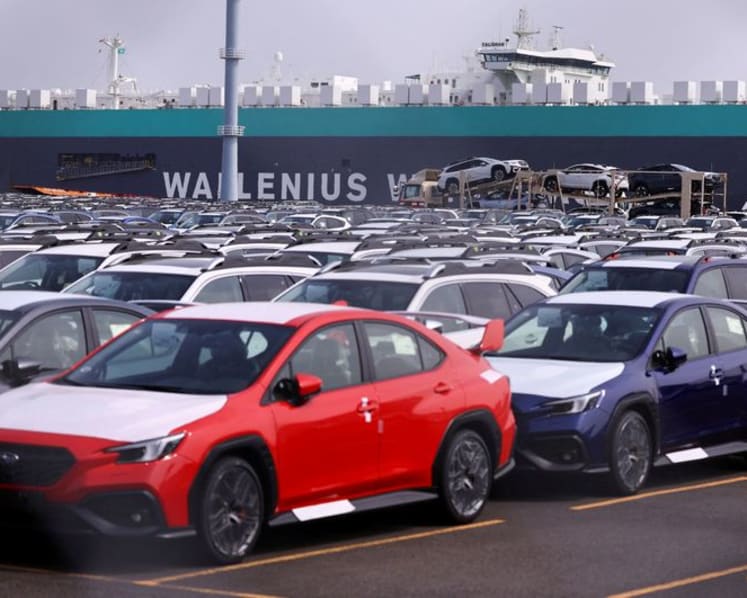 Japan says economy recovering but US tariff impact seen in auto sector