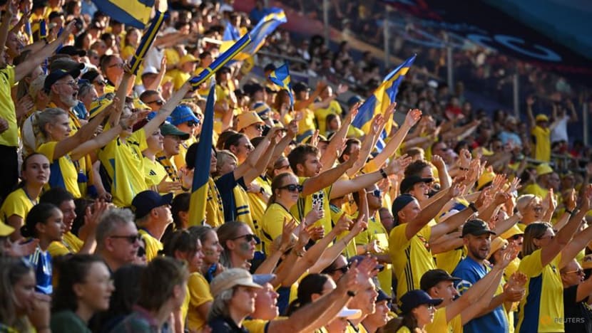 Heat wilts players but not fans' spirit at Sweden-Denmark Euros clash Heat wilts players but not fans' spirit at Sweden-Denmark Euros clash