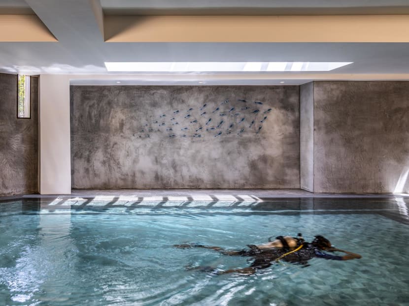 A heated pool in the basement of this Singapore home serves as the ‘office’ for its owners A heated pool in the basement of this Singapore home serves as the ‘office’ for its owners