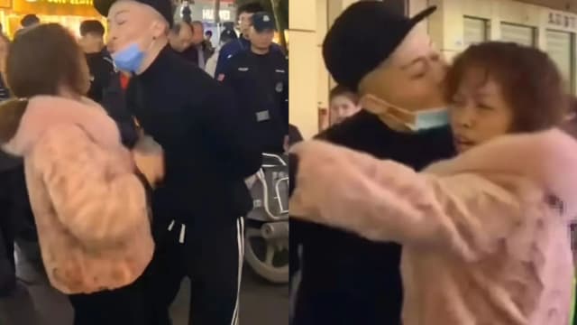 重庆两摊主抢位起争执 男摊主竟用吻击退大妈