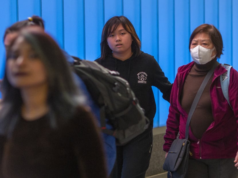 Passengers arriving at the Los Angeles International Airport in the United States on Jan 18, 2020, the first day of health screenings for coronavirus of travellers from Wuhan, China.