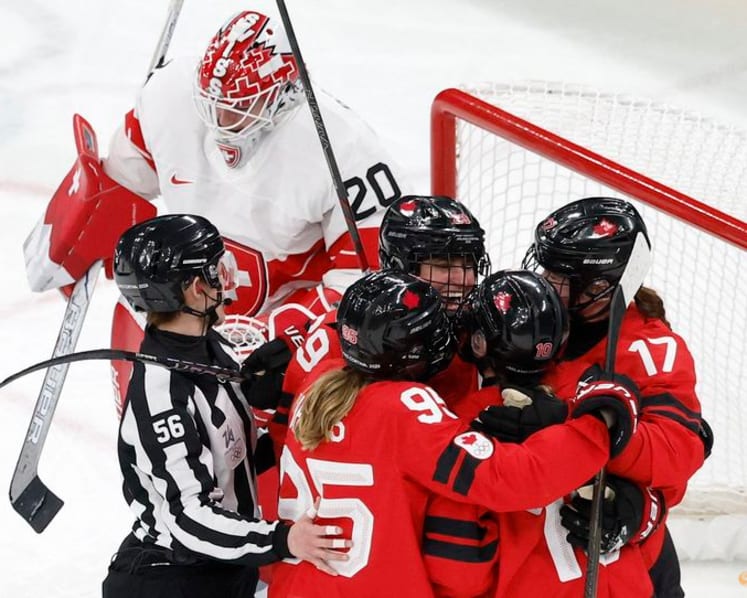 Ice hockey-Canada look to captain Poulin in title defence after goal-scoring record