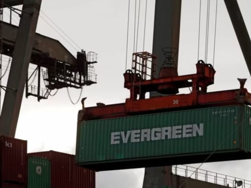 A crane lifts an Evergreen Marine container at Kaohsiung Port, Taiwan Aug 7, 2017.

