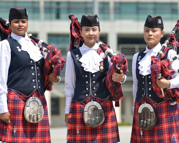 These members of the all-female Singapore police band can sing, dance and play the bagpipes