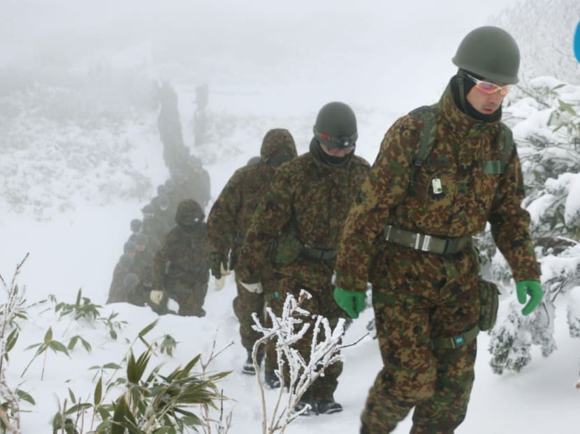 Japanese Self-Defense Force personnel take part in a search operation on Mt. Asahidake in Hokkaido on Oct. 18, 2017. Four people — two Japanese, a Malaysian man and a Singaporean woman — were found alive after going missing a day earlier on the snowy mountain. Photo: Kyodo News