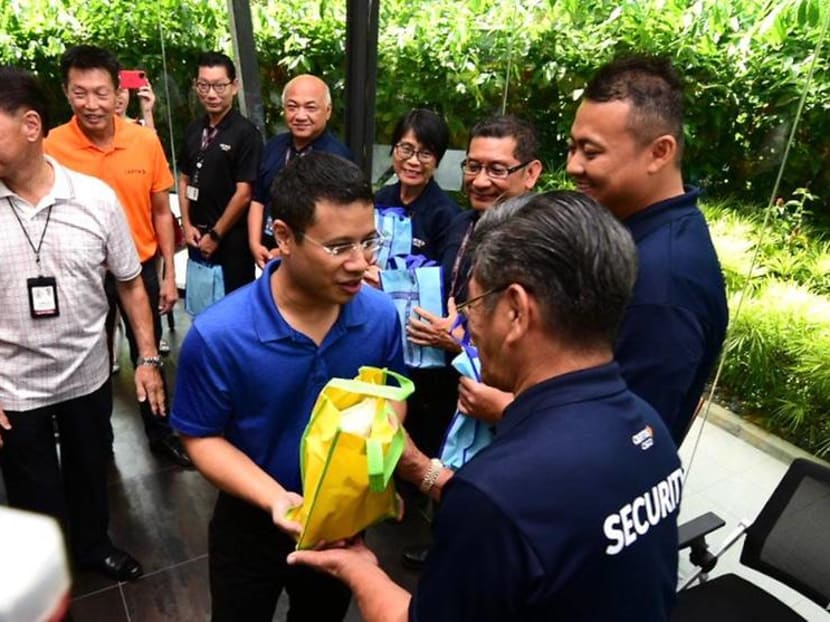 Minister for Social and Family Development Desmond Lee distributes welfare packs to frontline workers at Civil Service Club @ Loyang on Feb 29, 2020.