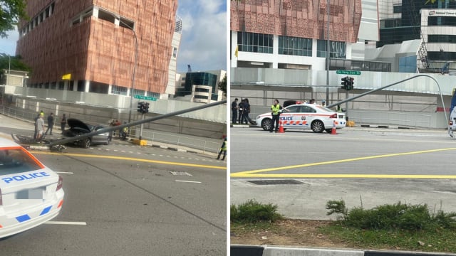 轿车撞倒灯柱 两名路人受伤