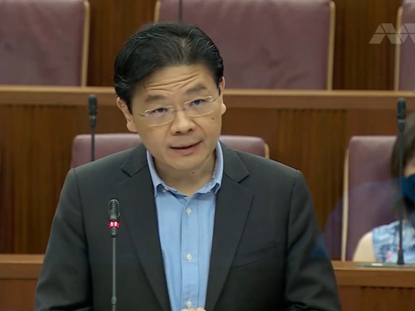 Finance Minister Lawrence Wong speaking in Parliament on March 2, 2022.