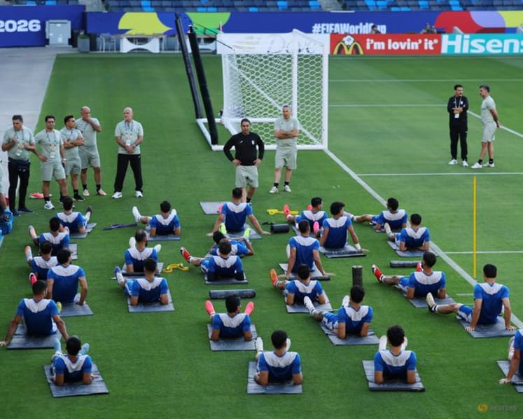 Iran's manager, striker pledge to play for all Iranians despite protests