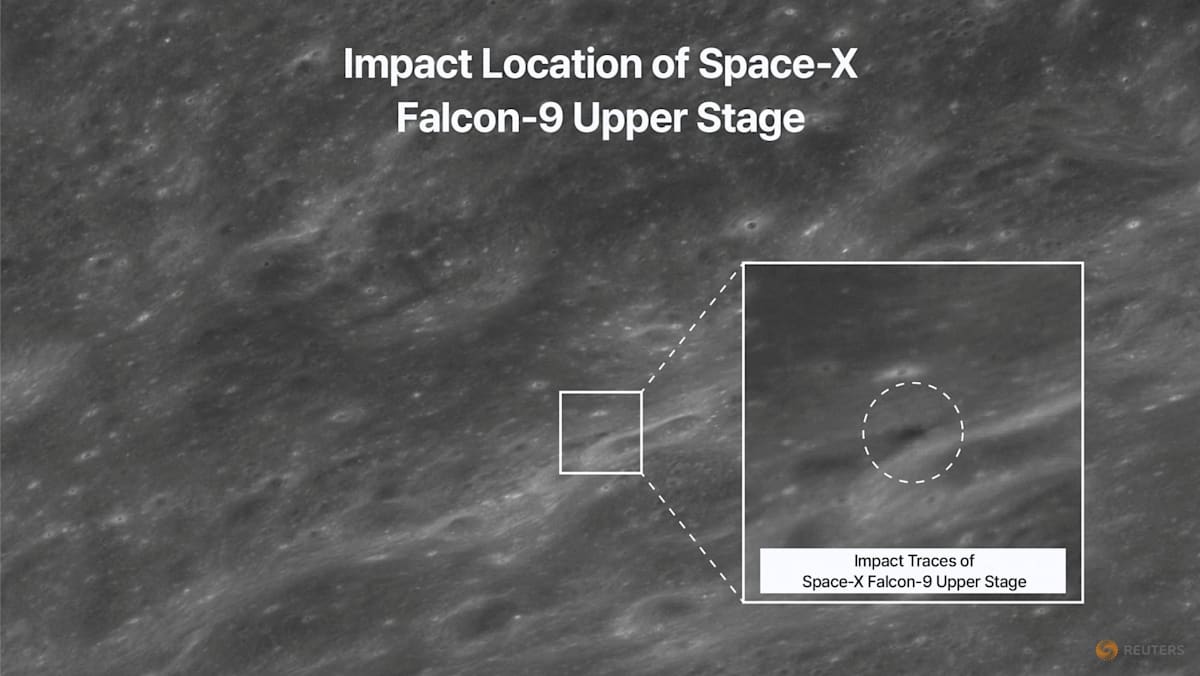 Black and white satellite image showing the impact location of a SpaceX Falcon-9 upper stage on a planetary surface.