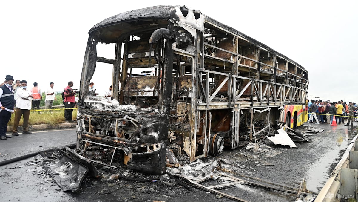 Bus catches fire after being hit by a motorcycle in southern India, killing at least 25