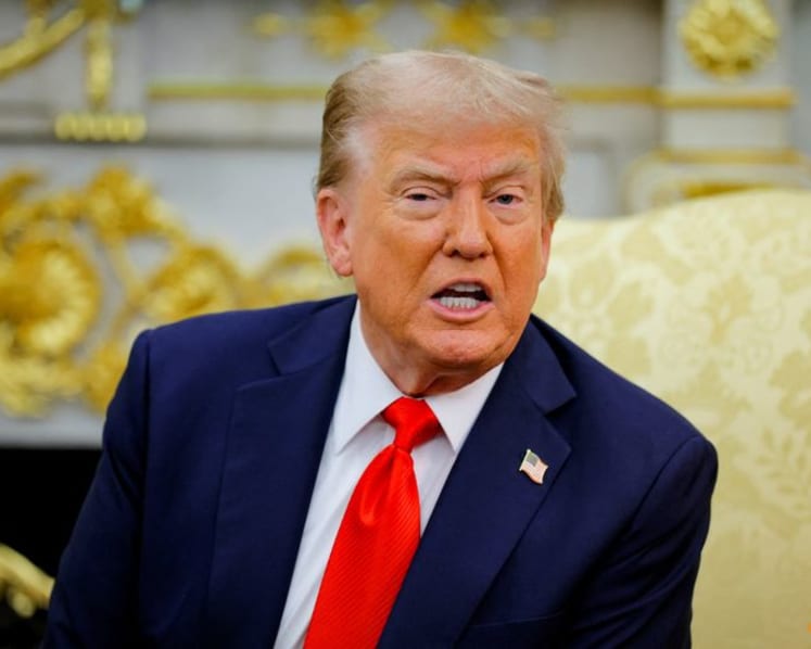 Trump signs order to lower US tariffs on Japan autos to 15%