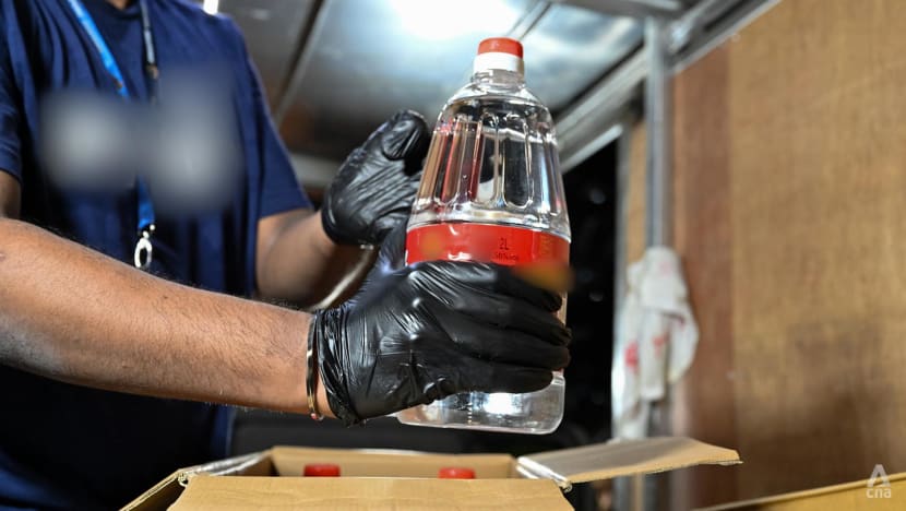4 people arrested; 257 bottles of contraband liquor, 2 distillery machines seized in Singapore Customs raids