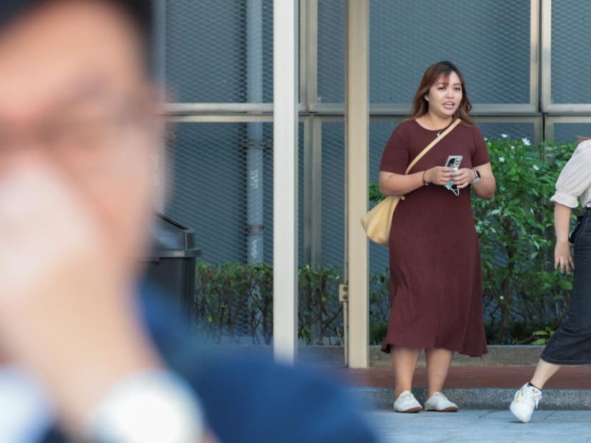 Jamie Lee Xiuling (in brown) leaving the State Courts on May 14, 2024. Jamie Lee Xiuling (in brown) leaving the State Courts on May 14, 2024.