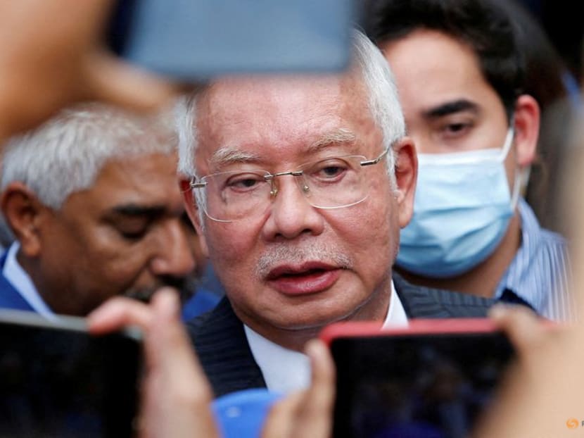Former Malaysian Prime Minister Najib Razak speaks to journalists outside the Federal Court during a court break, in Putrajaya, on Aug 23, 2022. 