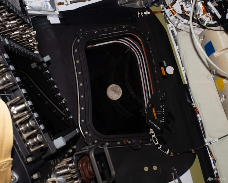 Artemis II moon crew flies farther than humans have ever gone before