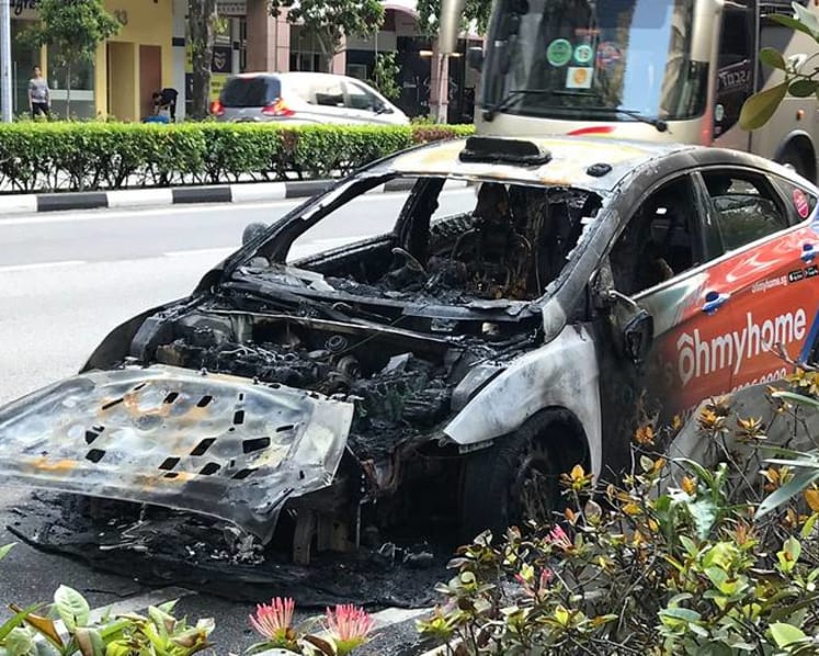 Taxi bursts into flames along Middle Road