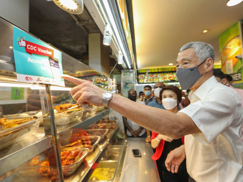 Prime Minister Lee Hsien Loong (pictured) said that the Community Development Council vouchers are meant to support shops and hawker stalls in neighbourhoods that have been hit hard by the Covid-19 pandemic. Prime Minister Lee Hsien Loong (pictured) said that the Community Development Council vouchers are meant to support shops and hawker stalls in neighbourhoods that have been hit hard by the Covid-19 pandemic.
