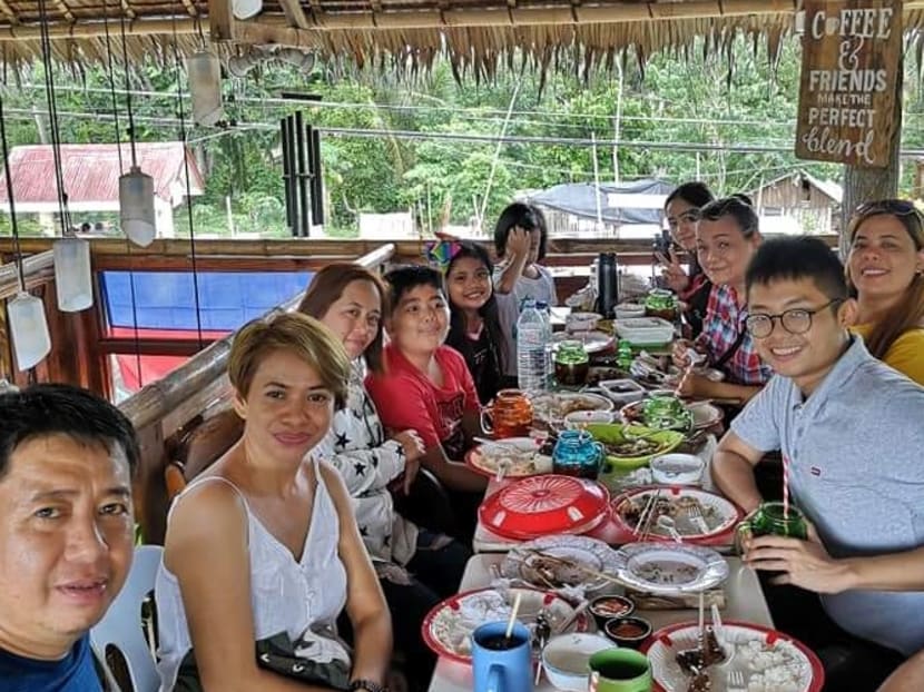 The author (first from the right), having lunch with his Filipino friends after an outing.