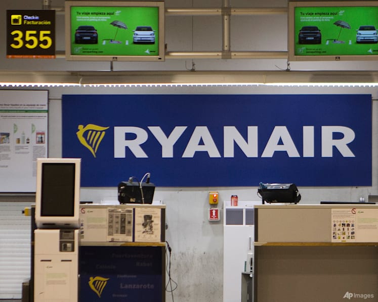 Broken engine parts shattered Ryanair plane window, partially sucking passenger out, US investigators find