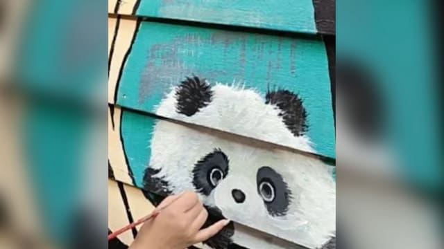 在槟城姓周桥画熊猫 中国女游客被批挑战当地法律