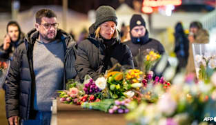 Tears and stunned silence at vigil for Swiss fire victims