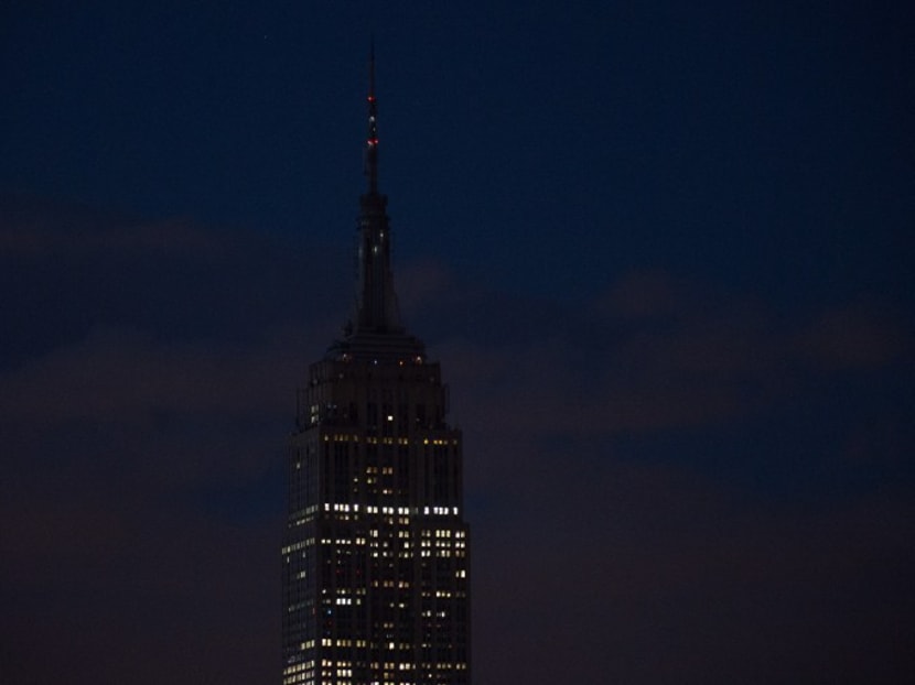 The Empire State Building goes dark in New York on June 12, 2016, in reaction to the mass shooting at a gay nightclub in Orlando, Florida. Photo: AFP