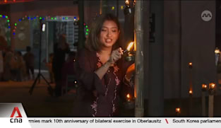 A glow of tradition: Malaysian village lights up 'pelita panjut' lamps for Hari Raya