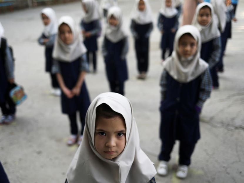Afghan girls attend school in Kabul.