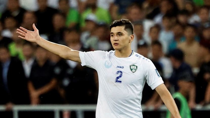 Ukbekistan's Khusanov sends apology shirt to cameraman injured in World Cup opener