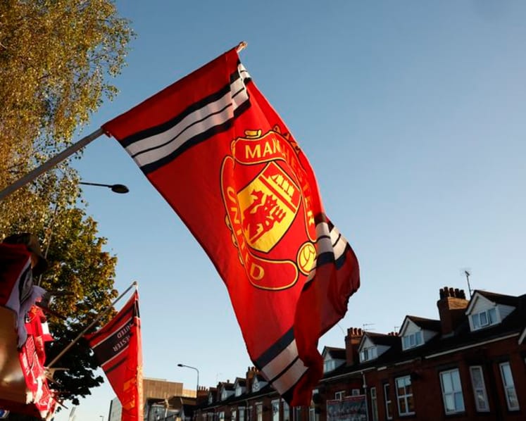 Manchester United lift earnings forecast after top three Premier League finish