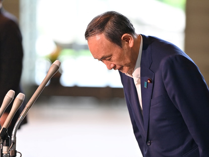 Japan's Prime Minister Yoshihide Suga bows during a press conference at the prime minister's office in Tokyo on September 3, 2021, following his announcement that he will not seek re-election for Liberal Democratic Party (LDP) leadership this month.