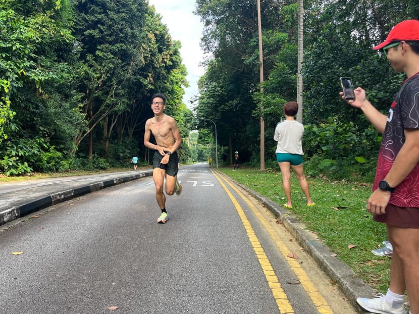 Winner Toh Wen Sheng grimacing as he sprints to the finish line on his final lap of "The Xterminator" race on July 29, 2023. Winner Toh Wen Sheng grimacing as he sprints to the finish line on his final lap of "The Xterminator" race on July 29, 2023.