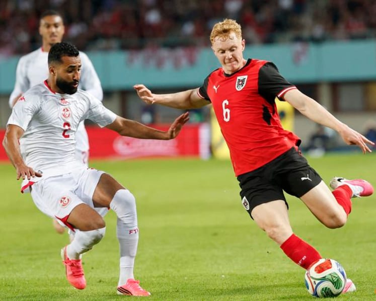 Austria fight back from early red card to beat Tunisia