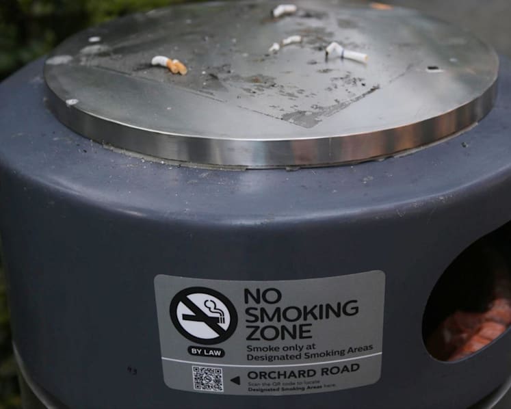 Duo smoking at non-smoking area on Orchard Road to be charged with abusing NEA officers