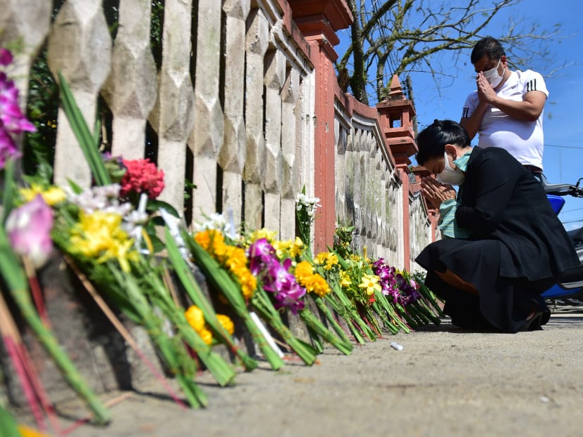 People offer prayers in honour of the dead outside the Prachapirom Temple during the Tham Boon Duan Sib (Sart Thai) festival in Thailand's southern province of Narathiwat on Sept 3, 2020.