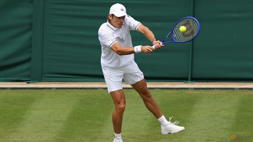 Honorary Brit De Minaur eases into second round